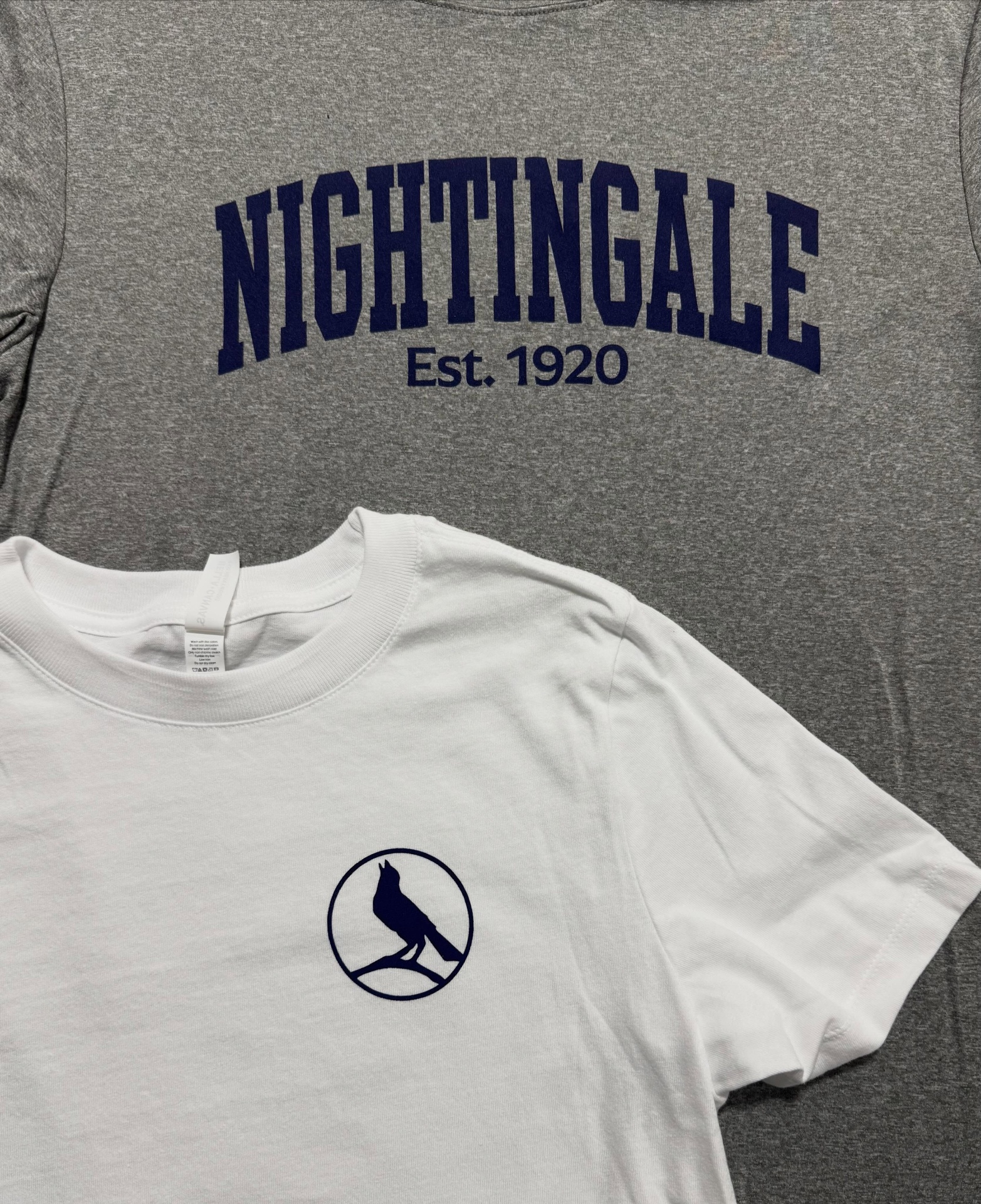 Nightingale Est. 1920 varsity tee with bird logo